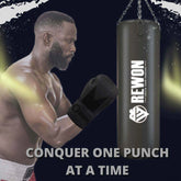 Man wearing Rewon boxing gloves practicing with punching bag, promoting fitness and boxing training efficiency.